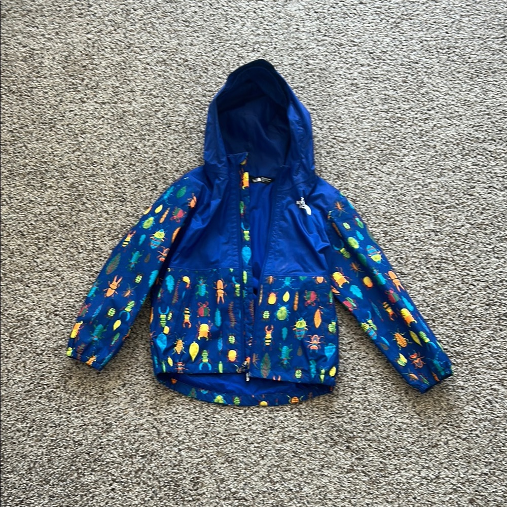 The North Face Blue Raincoat with Polka Dot Pattern